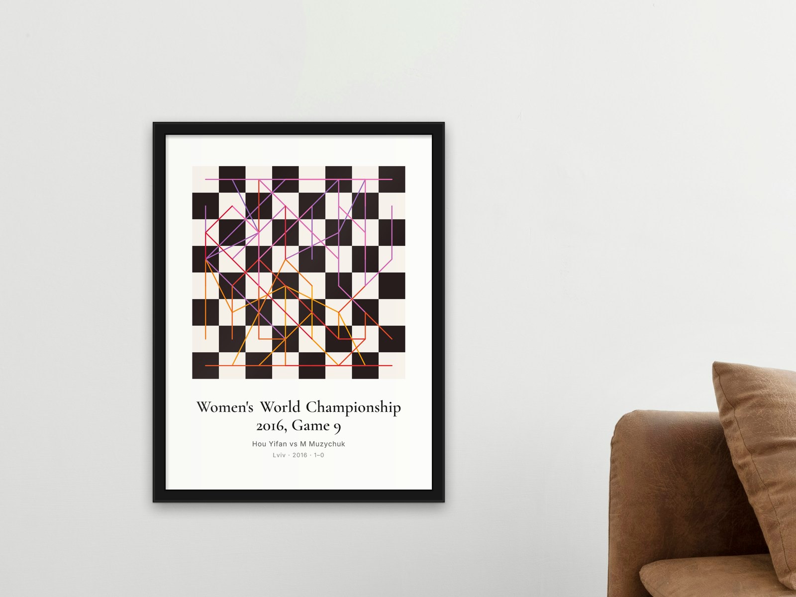 A framed chess game print on a wall at home